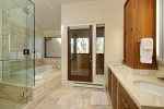Primary bathroom features exquisite tile, steam shower, and separate Jacuzzi tub